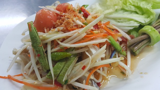 Thai green papaya salad. This dish is dressed with a tangy sauce that whets the appetite. 