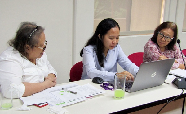 Dr, Josephine Agravante (Postharvest Specialist) (left) and Dr. Matilde Maunahan (Value Chain Specialist) (right) finalizing their workplans with the assistance of project staff