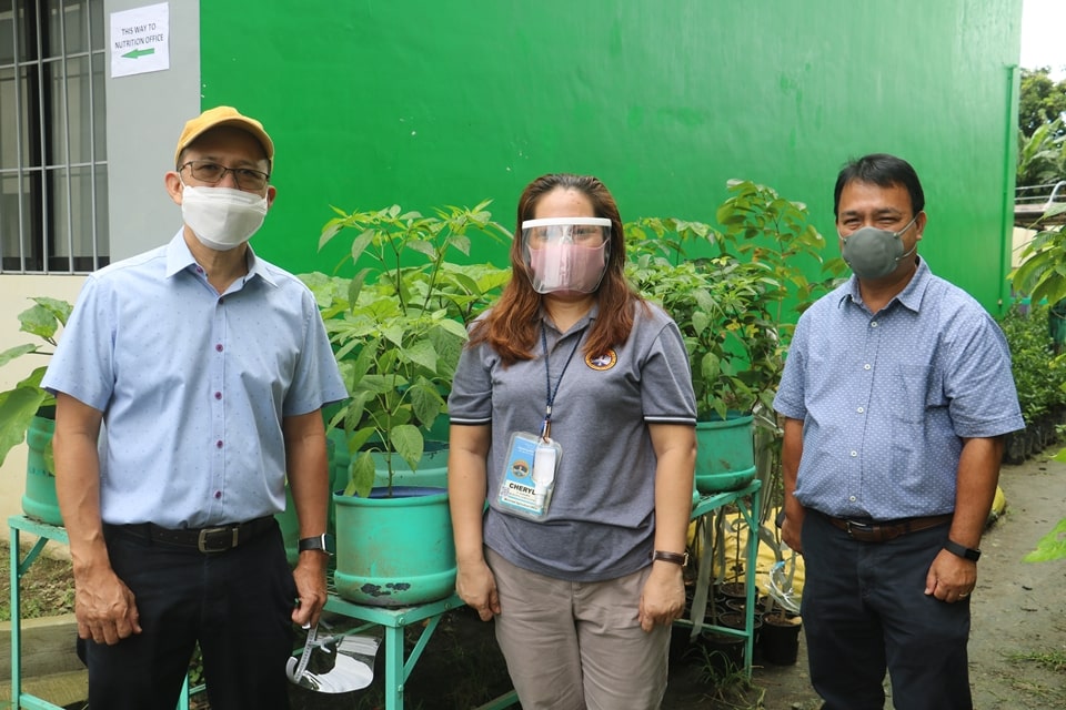 Dr. Gregorio (left) and Dr. Labios (right) with Los Baños Municipal Agriculturist Cheryll L. Gonzales.